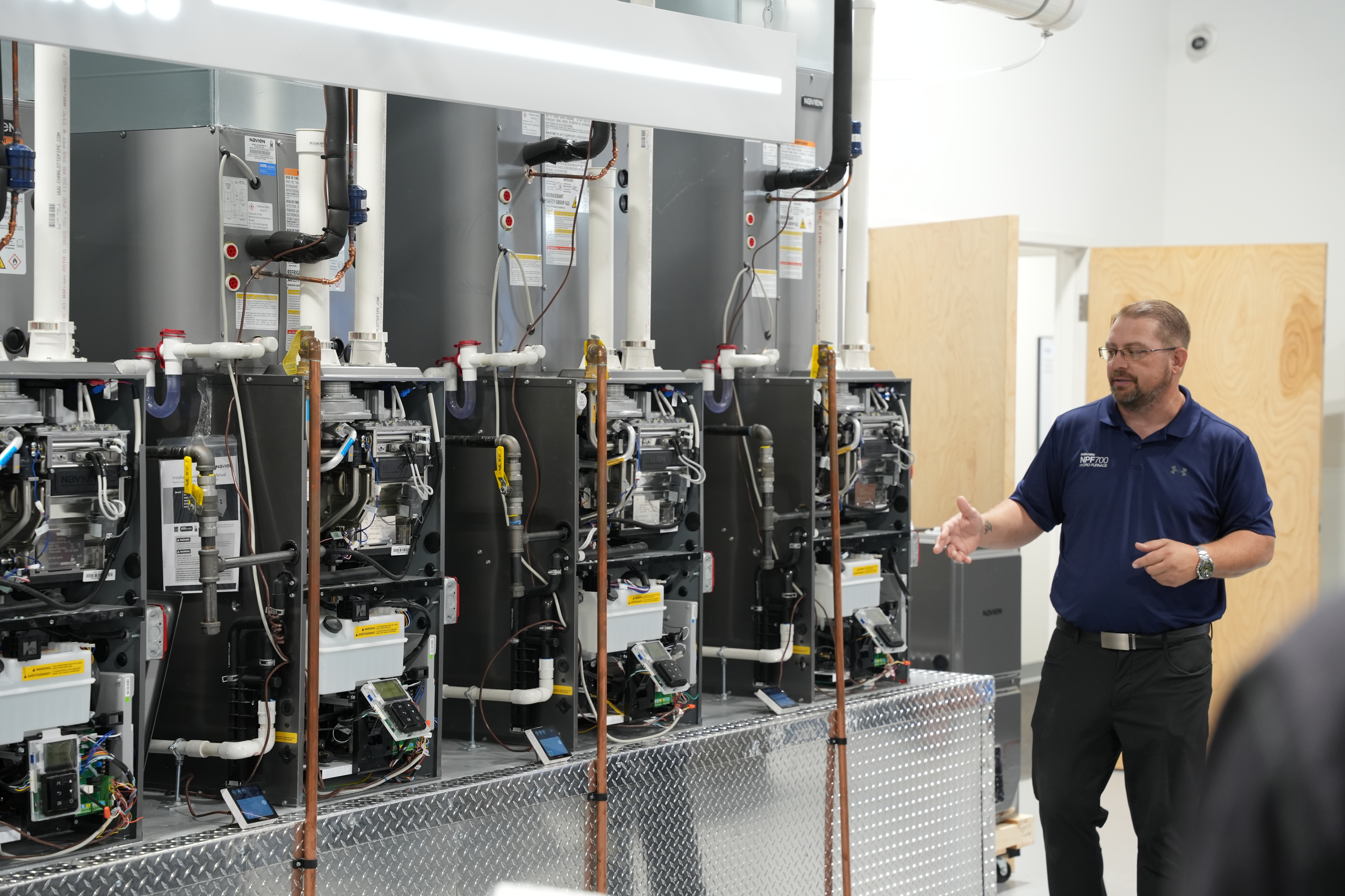 Demonstration of Navien commercial boiler systems during hands-on training at the New Jersey Training Academy